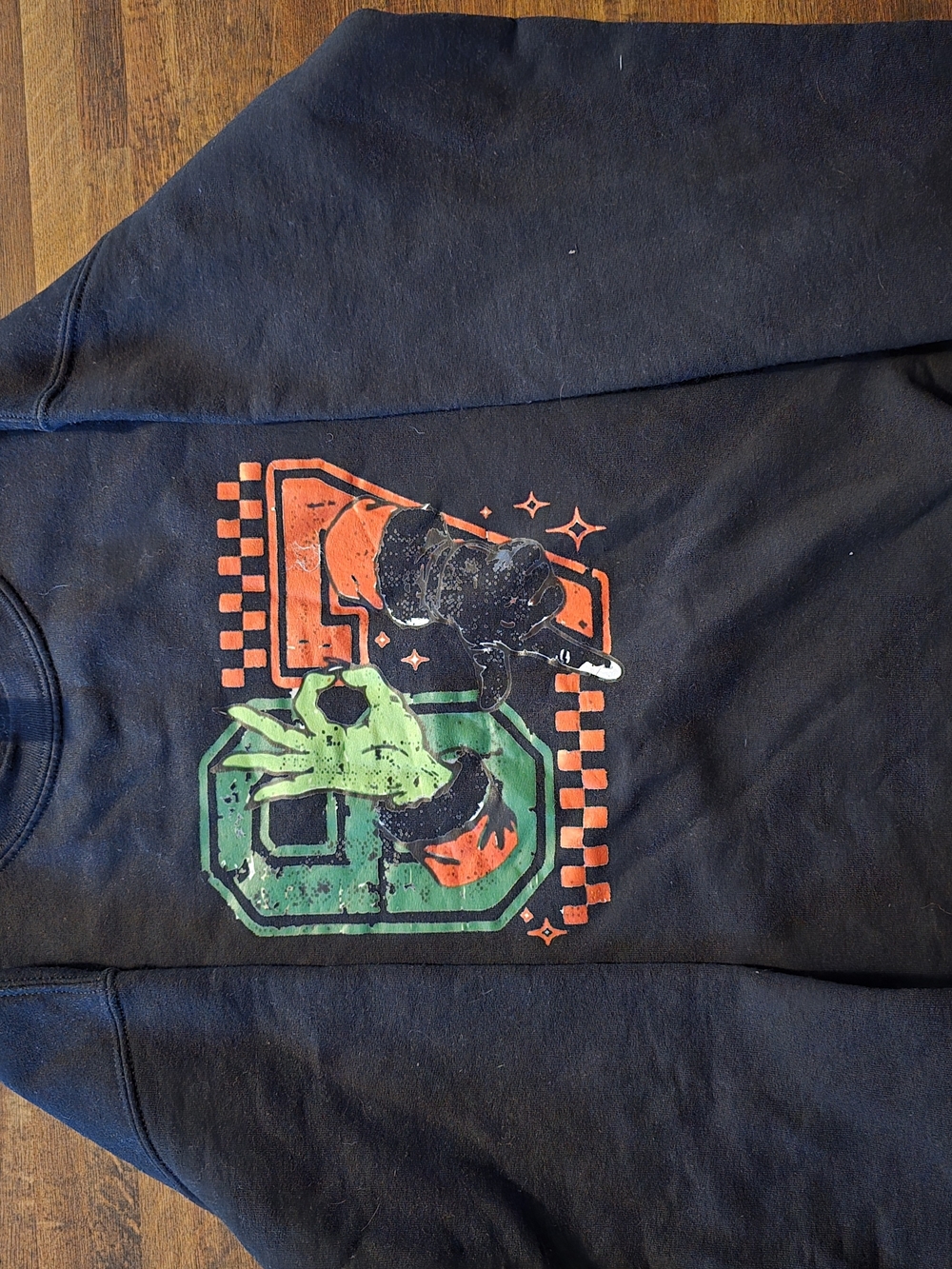 Black Graphic Crewneck Sweatshirt with Green & Orange Design